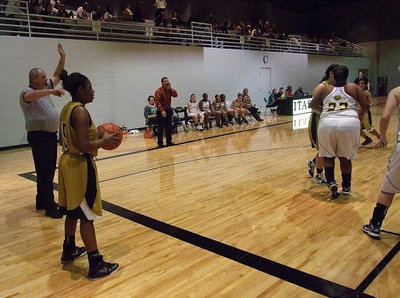 Image: Jameka Copeland(5) tries to pass the ball in to teammates Alyssa Richards(24) and Ryisha Copeland(11).