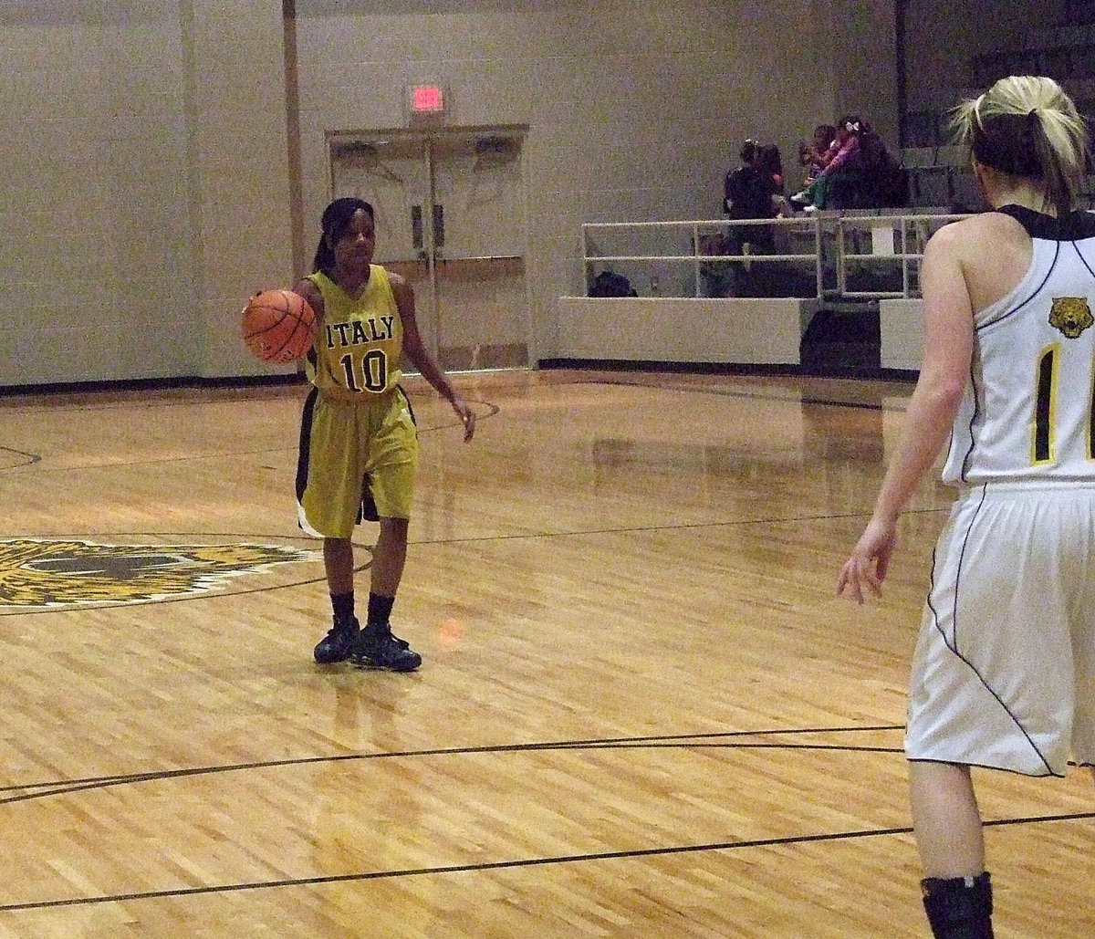 Image: Kendra Copeland(10) brings the ball up court as Italy works out of the half court set.