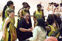 Image: Lady Gladiator head coach Melissa Fullmer talks strategy during a timeout.