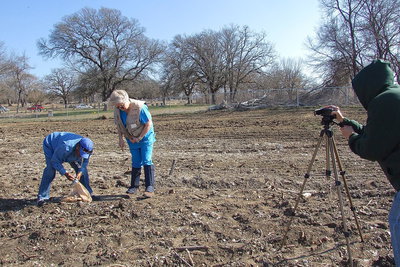 Image: Videographer Susan Turner records Bell and Dr. Graveyard as they explain the devastation that has occurred at the cemetery by the bulldozers of the Creek Land and Cattle Company.
