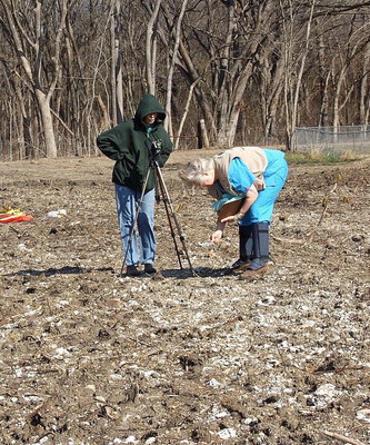 Image: Videographer Susan Turner and Deborah Franklin retrieve evidence for the video which will hopefully put a stop to the crimes being committed by the Creek Land and Cattle Company as its bulldozers continue to destroy sections of Hughes Cemetery.