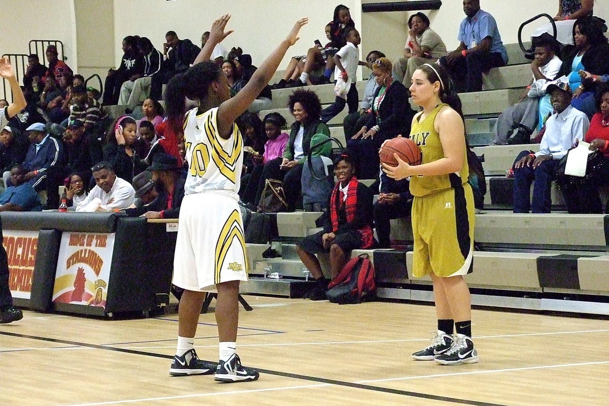 Image: Lady Gladiator senior Alyssa Richards(24) prepares to inbound as she looks for an open teammate against Triple A Academy.