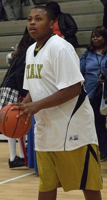 Image: Junior Gladiator Darol Mayberry(13) practices jumpers before the game against Triple A Academy.
