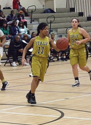 Image: Ryisha Copeland(11) sets up the Lady Gladiators in their half court offense against Triple A Academy