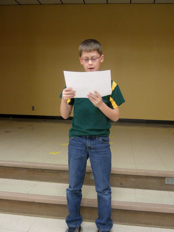 Image: Kort Holley reciting his poem about the Italy Gladiators.