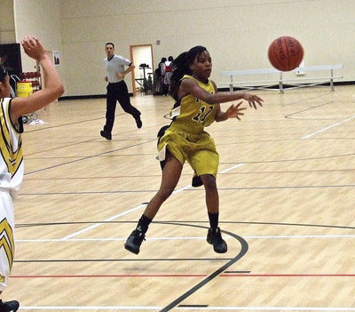 Image: Guard Kendra Copeland(10) pushes the ball up the floor and then passes to the wing.