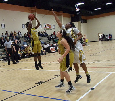 Image: Alyssa Richards(24) seals a Triple A Academy defender allowing Kortnei Johnson(3) to pull up for the jumper.