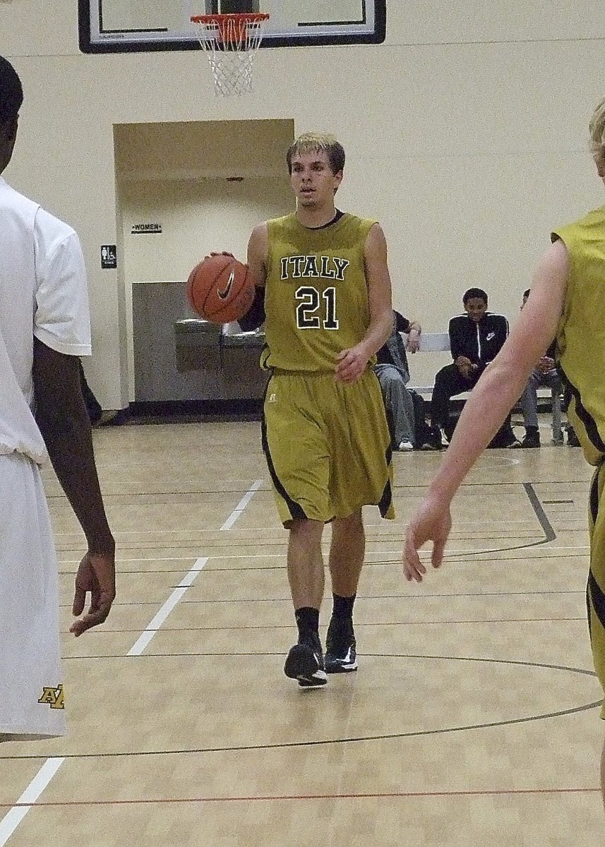 Image: Point guard? Center Cole Hopkins(21) shows his versatility by bringing up the ball and setting up the offense.