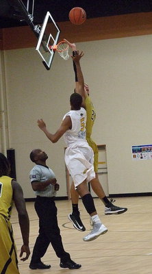 Image: Gladiator Cole Hopkins(21) wins the tipoff against Triple A Academy.