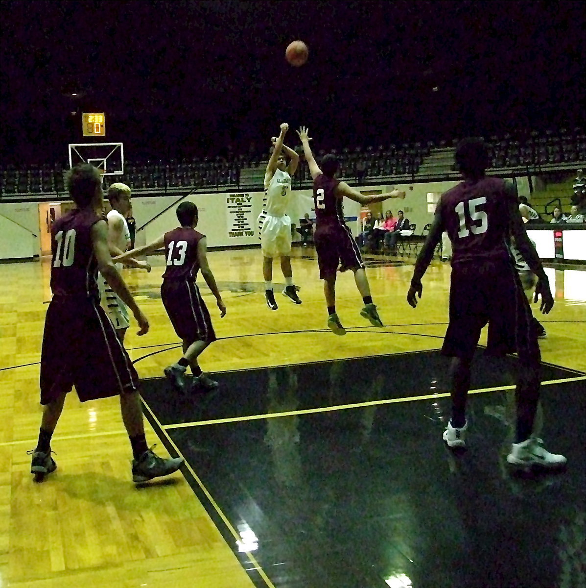 Image: Gladiator senior Reid Jacinto(5) shoots a 3-pointer over a Summit defender.