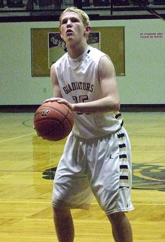 Image: Sophomore Gladiator Cody Boyd(15) goes to the line against Arlington Summit.