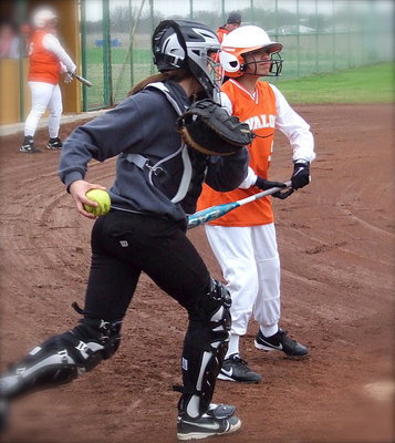 Image: JV catcher Lillie Perry dares Avalon base runners to go for it.