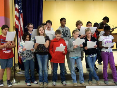 Image: Fifth graders learning their songs.