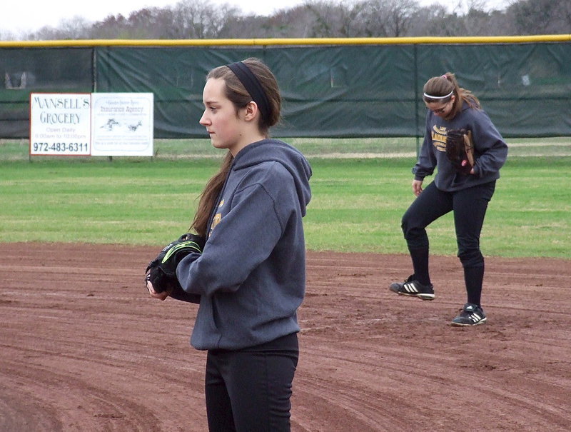 Image: Italy JV Lady Gladiators Jozie Perkins and Reagan Adams are a tad bogged down between first and second-base during a practice game with Avalon’s JV girls.