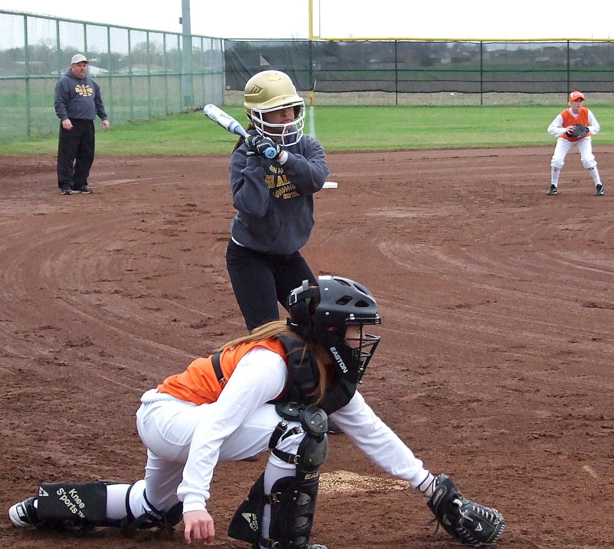 Image: JV Lady Gladiator Ashlyn Jacinto stands tall on a pitch low and outside.