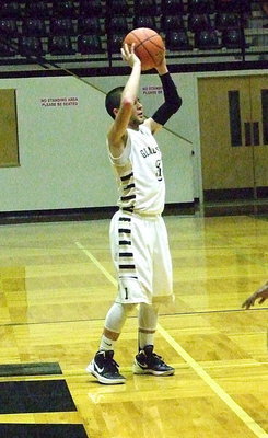 Image: Senior Gladiator Caden Jacinto(2) looks for an open teammate in his final home basketball game as a Gladiator.