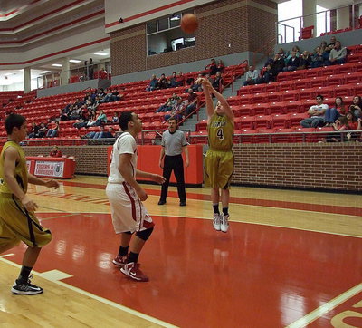 Image: Sophomore John Escamilla(4) takes the shot from the wing.
