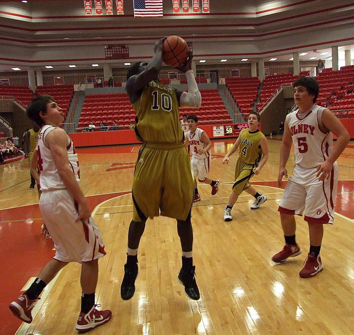 Image: Italy’s Ryheem Walker(10) grabs an offensive rebound and then goes back up for 2-points.