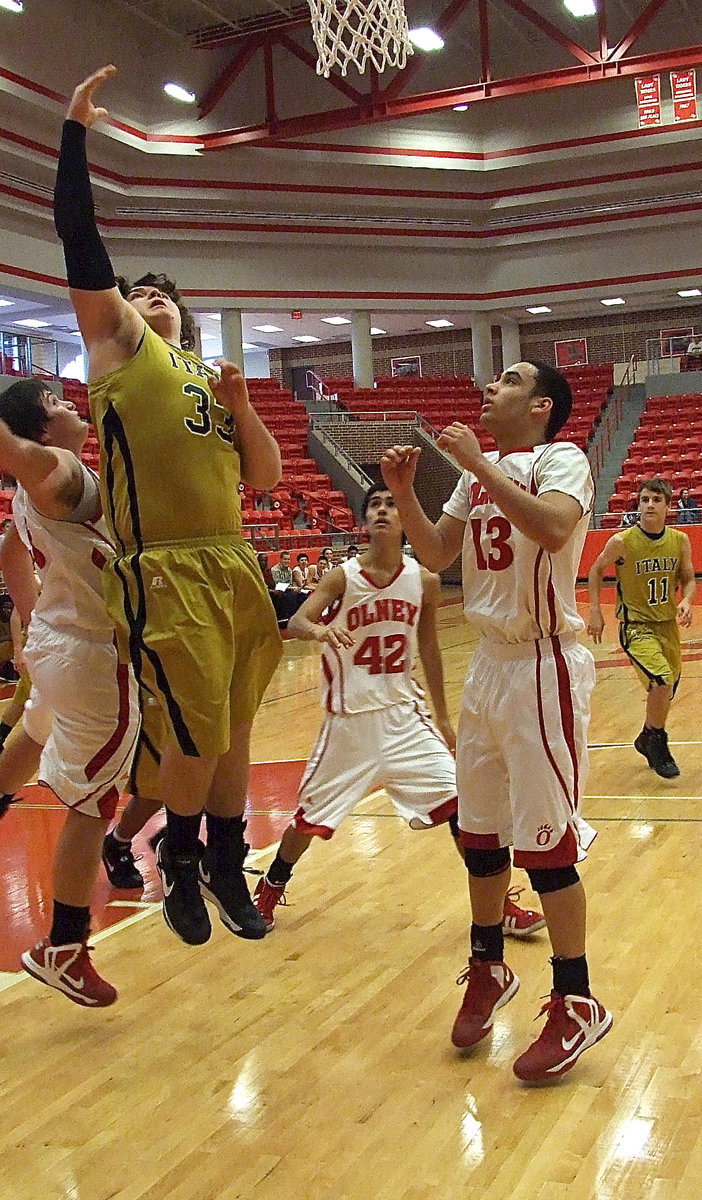 Image: Levi McBride(11) looks on as Kevin Roldan(33) wins inside to score with time ticking away.