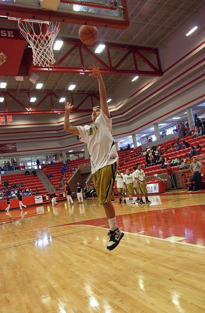 Image: Senior Kelvin Joffre lays in the ball during drills.