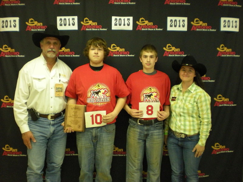 Image: Tristan Smithwick and Brandon Conner have successful catches at the 2013 San Antonio Livestock Show and Rodeo Calf Scramble.