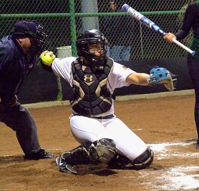 Image: She’s back… Alyssa Richards(9) has returned to patrol the diamond from behind the plate for Italy.