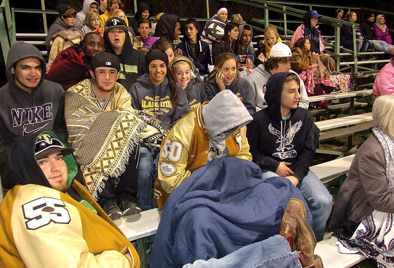 Image: Fans in the stands: schoolmates and fans brave the cold to support the Lady Gladiators softball season.