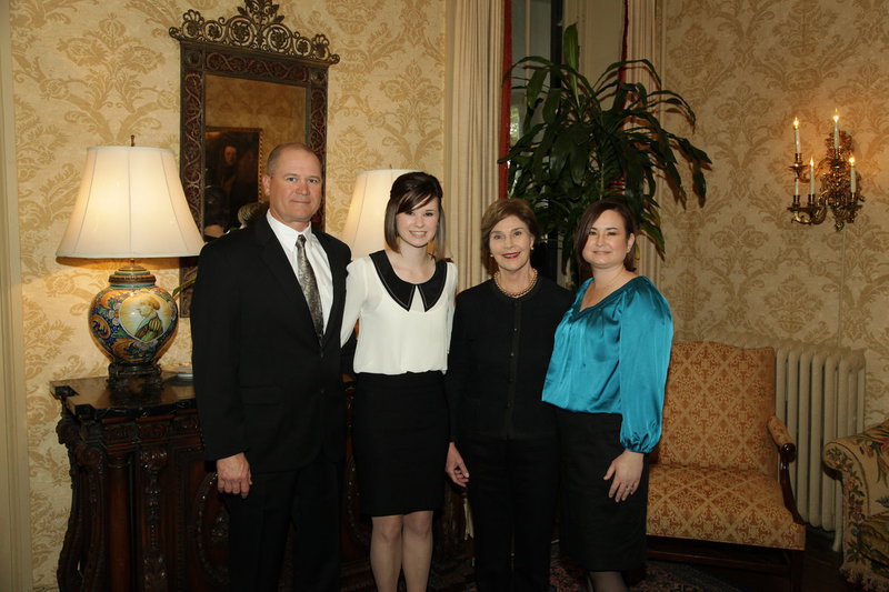 Image: Meagan and her proud parents pose for a photo with former First Lady Laura Bush at the Taking Care of Texas reception in San Antonio this past January.
    (L-R) Jerry Hooker, Meagan Hooker, Laura Bush, Andrea Hooker