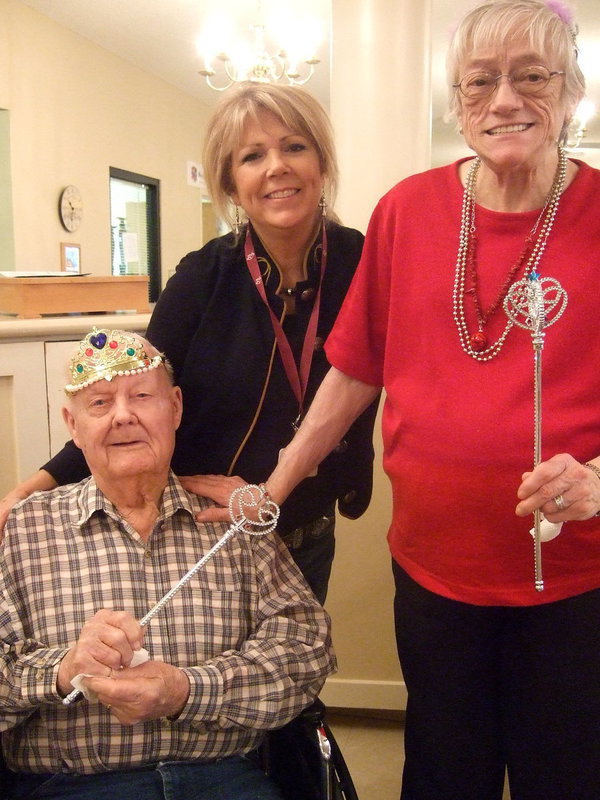 Image: King Jack, Celeste Carroll (activities director) and Mary Vance celebrate Valentines Day.