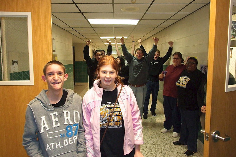 Image: CBI classmates and special olympic teammates Nathan Brock and Katie Connor receive a champions sendoff from supportive Italy HS students as they leave to compete in a basketball competition.