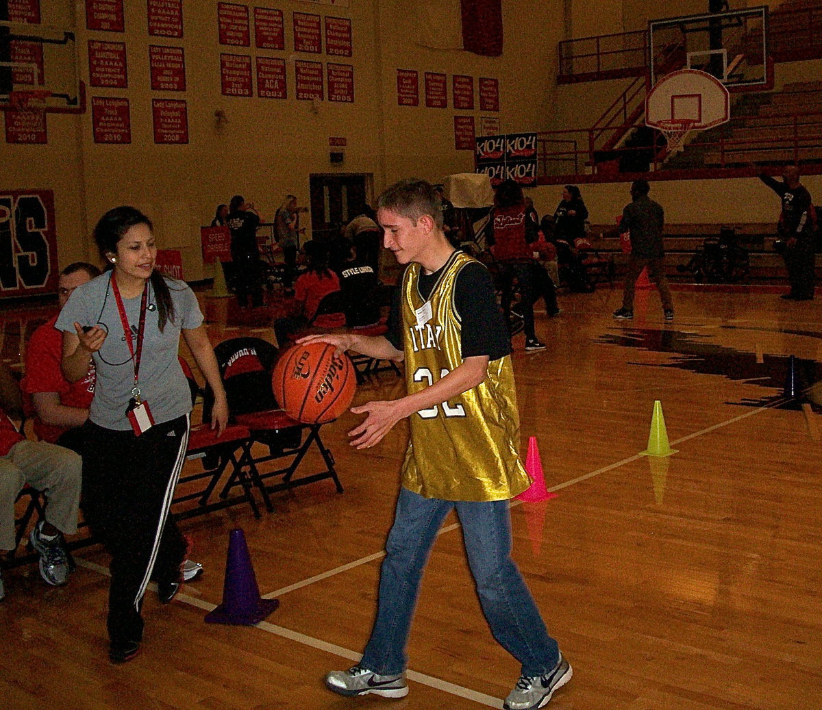 Image: Italy’s Nathan Brock #32 competes in the 10 meter dribble part of the basketball skills olympic competition. Brock earned a 3rd place medal with his superior court skills.