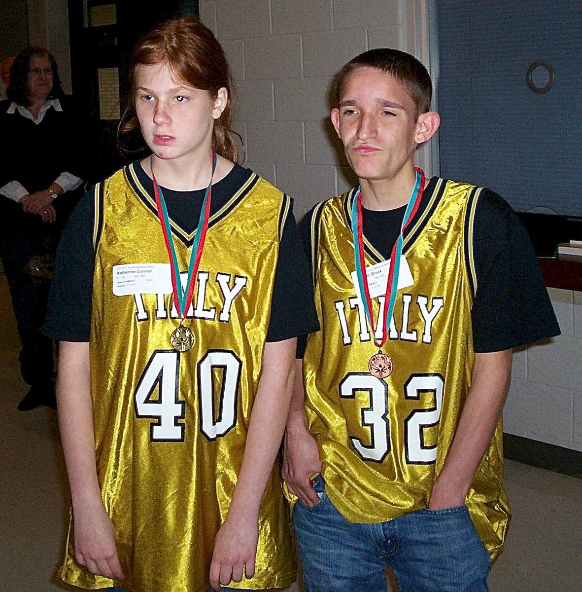 Image: Italy HS Special Olympic athletes Katie Connor and Nathan Brock still have their game faces on while posing for pictures with their olympic medals draped around their necks like heavyweight championship belts.