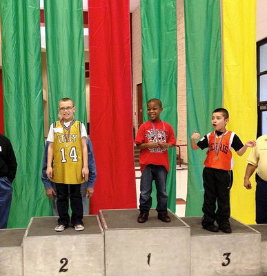 Image: Italy’s #14 Charlie Bolin earns a 2nd place medal as he proudly takes his spot atop the championship podium.