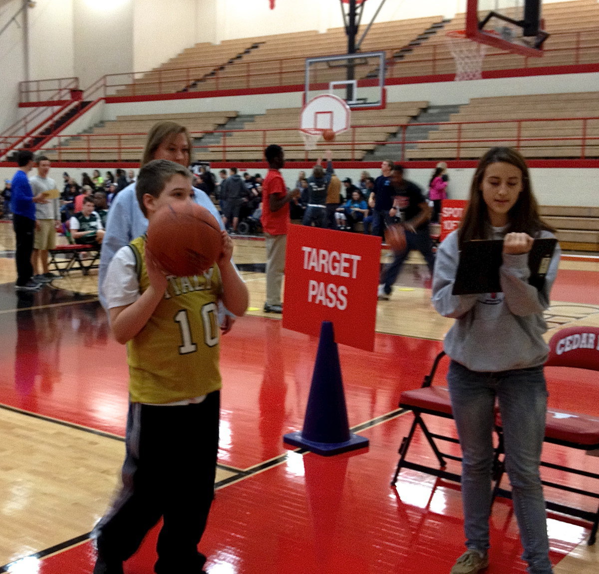 Image: Italy’s #10 Wyatt Ballard takes aim during the target pass challenge of the Special Olympics.