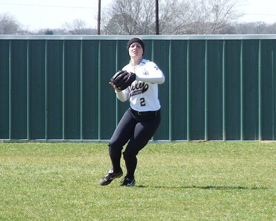 Image: Center fielder Madison Washington(2) catches a pop fly during pre-game warmups.
