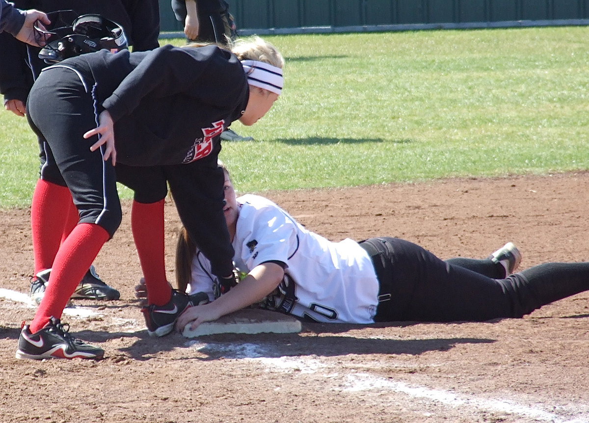 Image: Italy’s Paige Westbrook(10) waits for the umpire’s ruling who calls the sliding Lady Gladiator safe at third during a matchup with the Terrell Lady Tigers during this past weekend’s softball tournament held in Scurry Rosser. 1A Italy shutout 4A Terrell 9-0 and won three of their five games over a two day stretch.