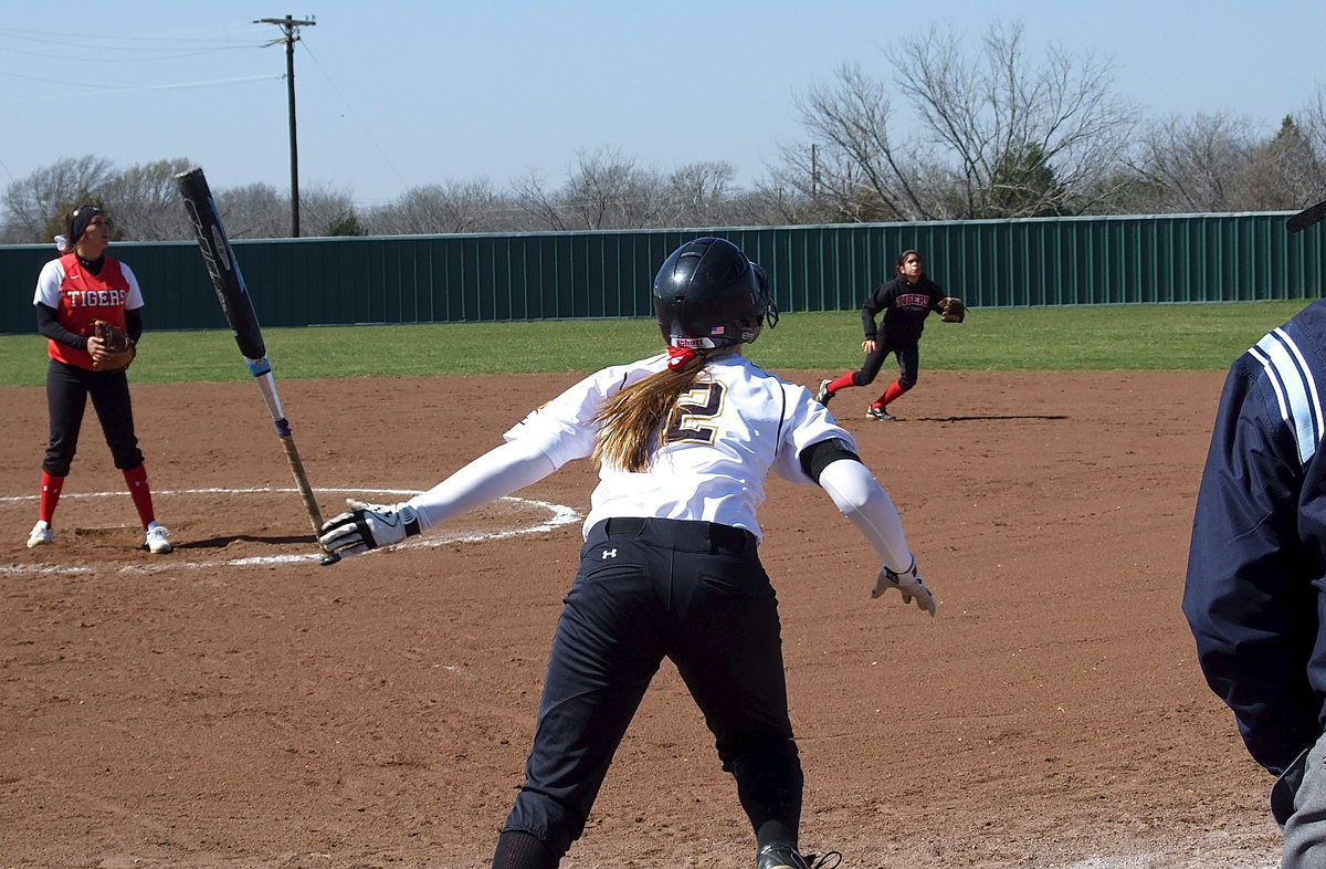 Image: Lady Gladiator Madison Washington(2) pops one up and then heads for first-base.