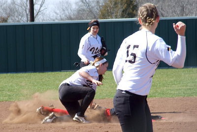Image: Pitcher Jaclynn Lewis(15) signals out as her catcher, Alyssa Richards, throws out a Terrell base runner at second-base with shortstop Paige Westbrook making the tag and  second baseman Morgan Cockerham backing up the play.