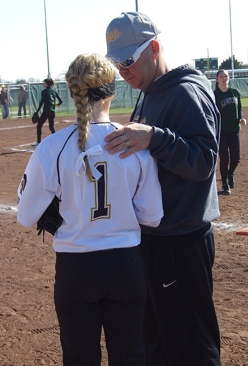 Image: Lady Gladiator Asisstant Coach/dad Michael Chambers talks with player/daughter Britney Chambers who is gaining valuable experience as a freshman.