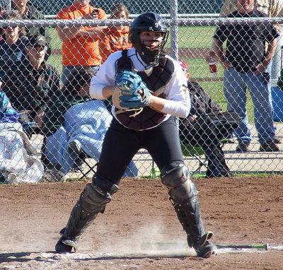 Image: Veteran catcher Alyssa Richards covers a bunt and then guns down the runner before the Tigers can reach first base.