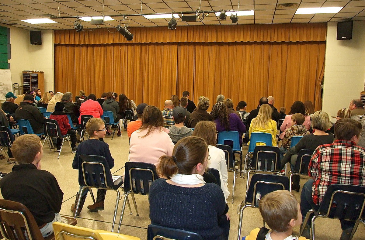 Image: The audience prepares for the opening scene.