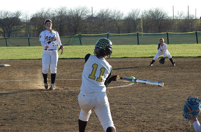 Image: Pitcher Jaclynn Lewis(15) and second baseman Bailey Eubank(1) get ready to attack the ball.