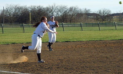Image: Third baseman Katie Byers(13) shoots down an Itasca runner at first.