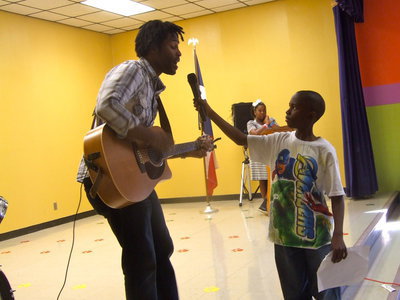 Image: Guitarist – Mr Erskin with Jaylon Lusk holding the microphone.