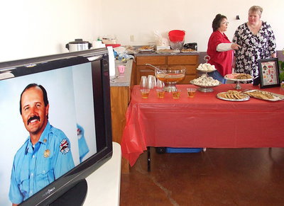 Image: A slide show allowed guests to catchup on the life of Lieutenant Greg Pickard who grew up in Italy.