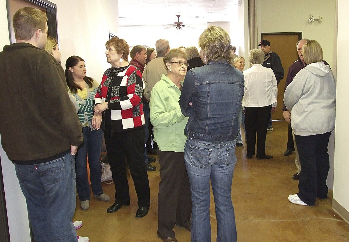 Image: Friends gather to comfort family members.