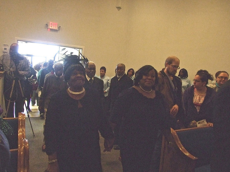 Image: First Lady Emeritus Ira Mae Square, whose husband pastored Mt. Gilead for 26 years, and First Lady Kechia Dixon walk in together.