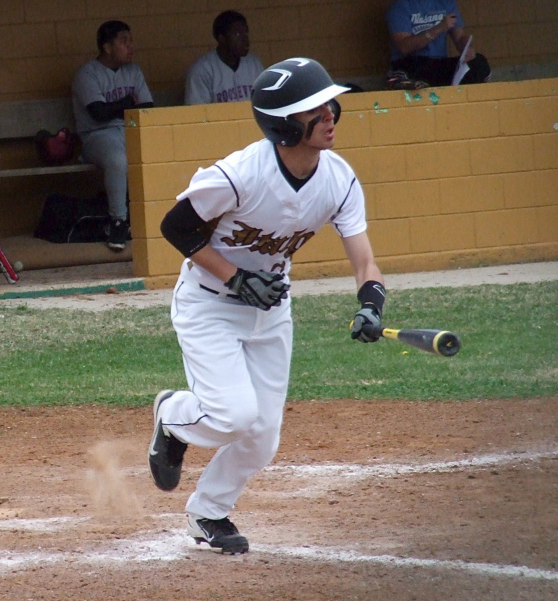 Image: Caden Jacinto(2) connects and then heads toward first-base.