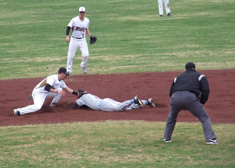 Image: Italy’s second baseman Reid Jacinto(5) backs up cousin Caden Jacinto(2) who attempts to tag a sliding Roosevelt player.