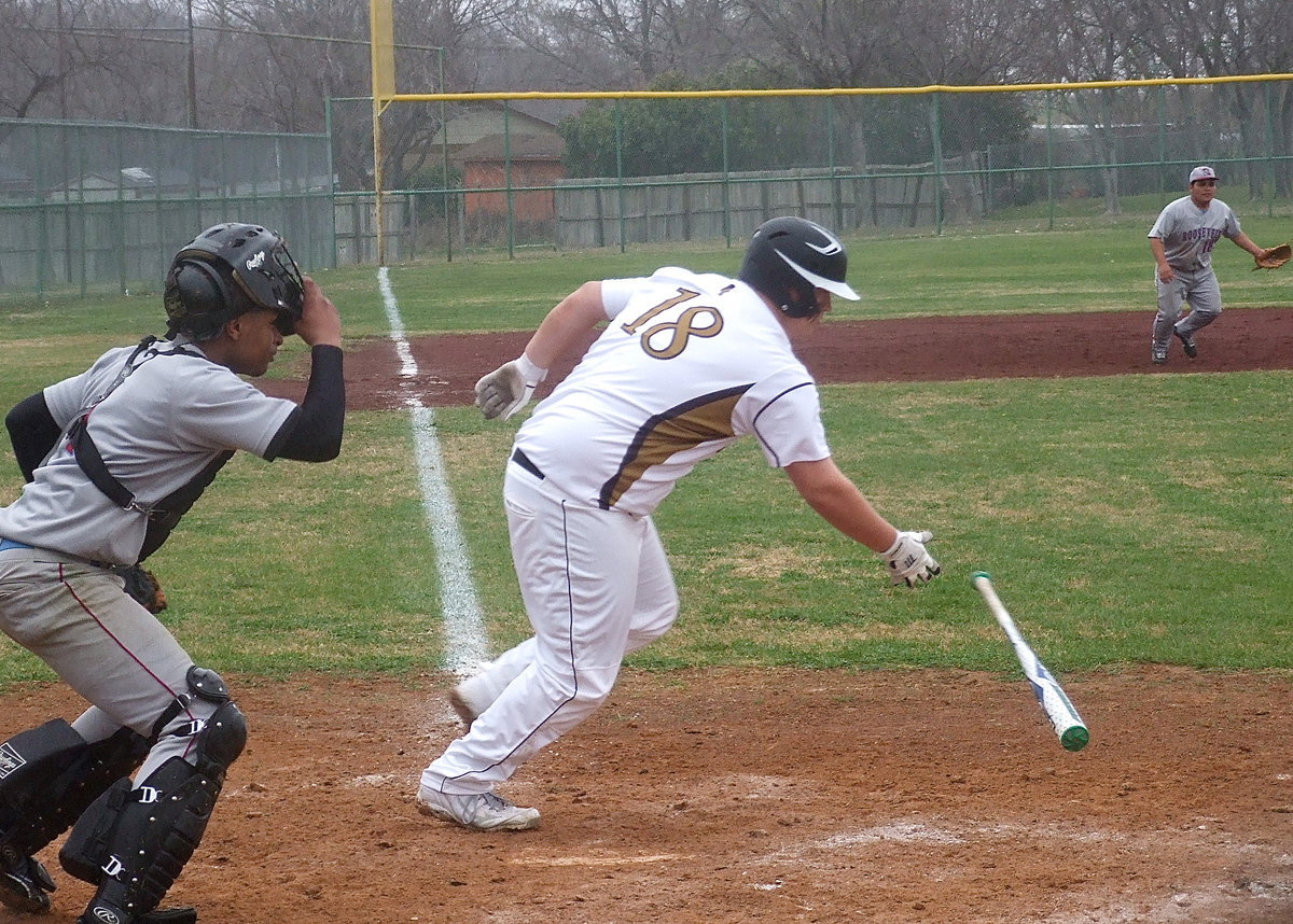 Image: Italy’s John Byers(18) connects and then scampers down the first-base line.